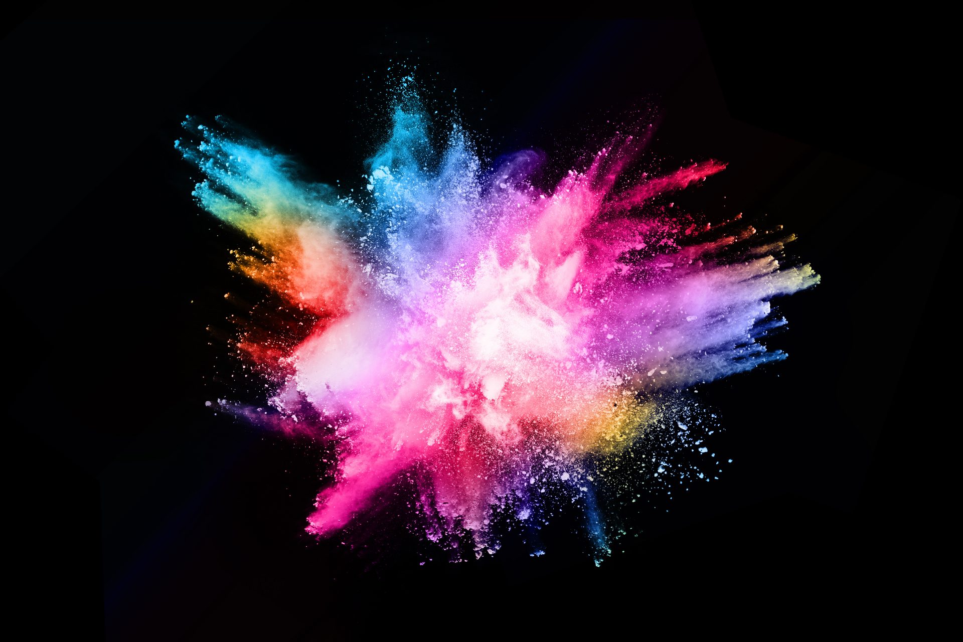 abstract colored dust explosion on a black background.abstract powder ...